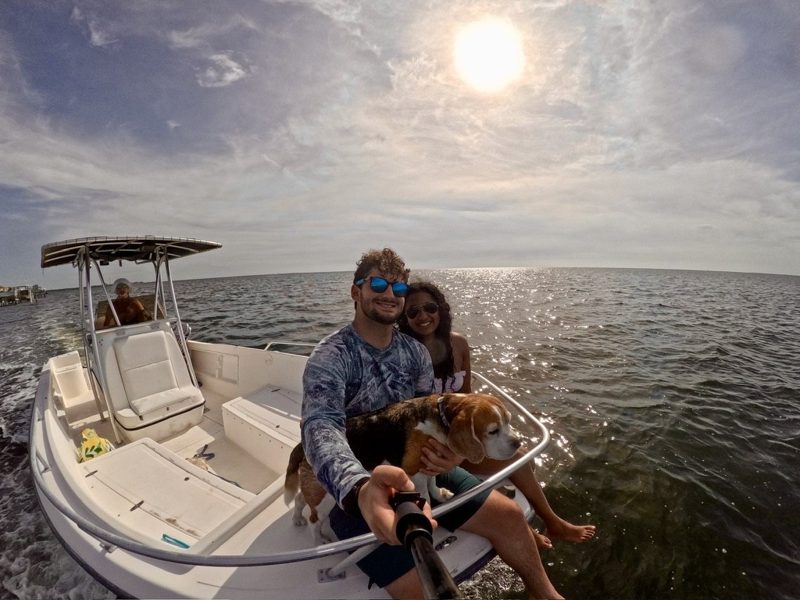 Tryfon, a companion, and a beagle together on a boat